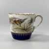 Royal Worcester porcelain cup and saucer. Robins, dated 1902. closeup bird