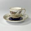 Royal Worcester porcelain cup and saucer. Robins, dated 1902. closeup