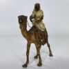 Franz Bergman bronze Arab riding a camel, c. 1900.