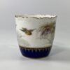 Royal Worcester porcelain cup and saucer. Robins, dated 1902.