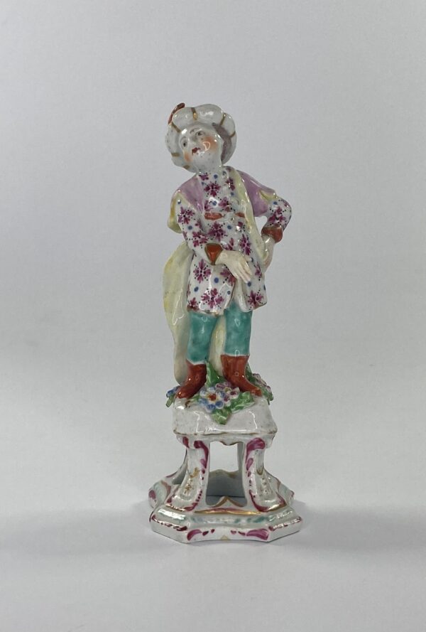 Bow porcelain figure of a Turkish Boy, c. 1760. blue and pink