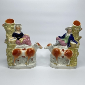 Pair Staffordshire cow spill vases, c. 1860.
