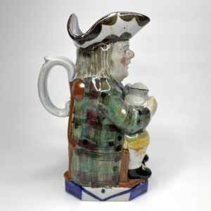 Staffordshire pottery ‘Tartan Coat’ Toby jug, c. 1830.